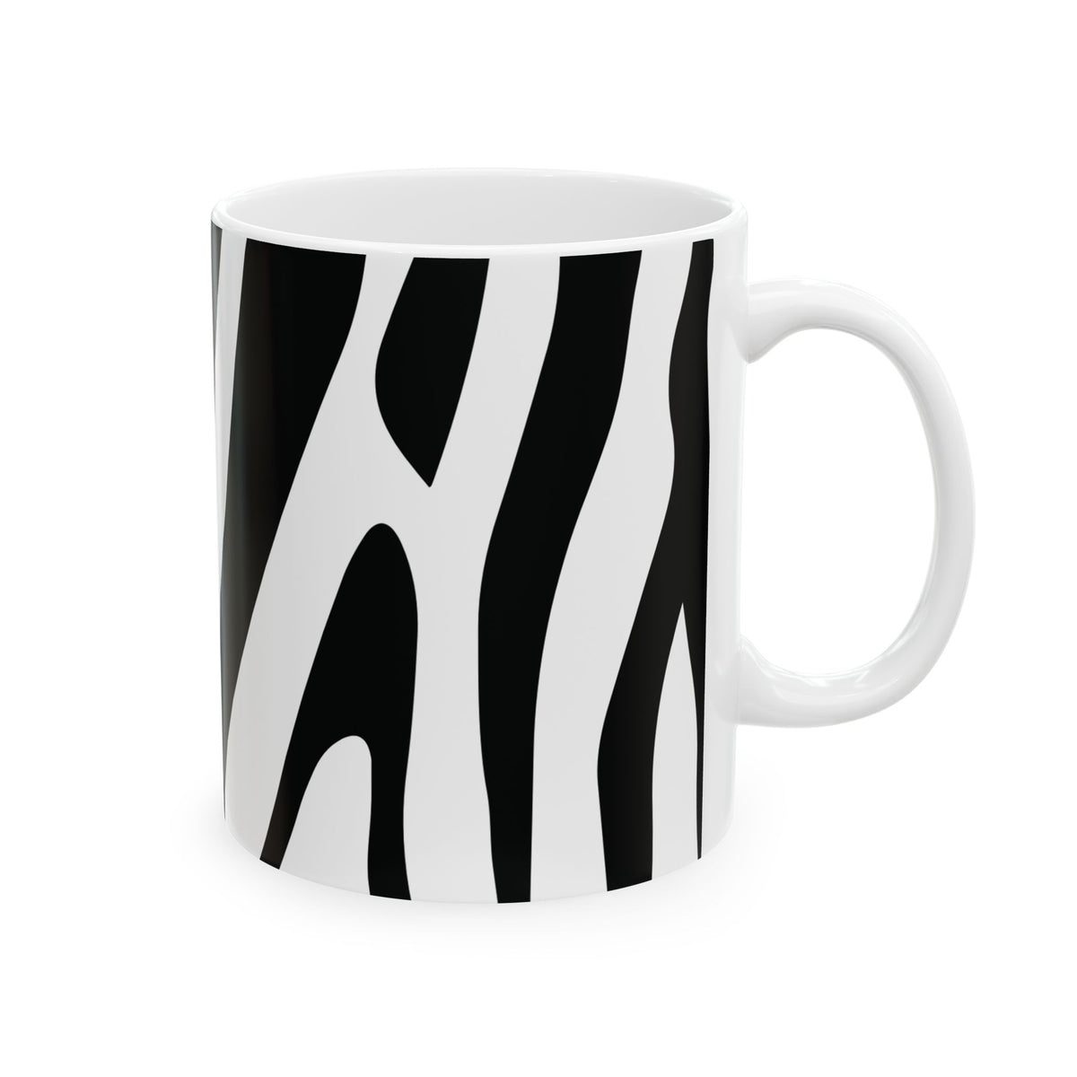 A white ceramic mug featuring a bold black and white zebra stripe pattern, shown against a plain white background.