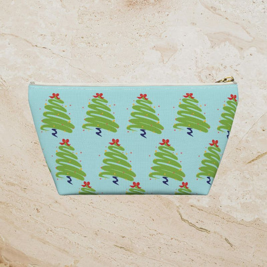 Back view of the icy-blue pouch showing its green Christmas tree print.