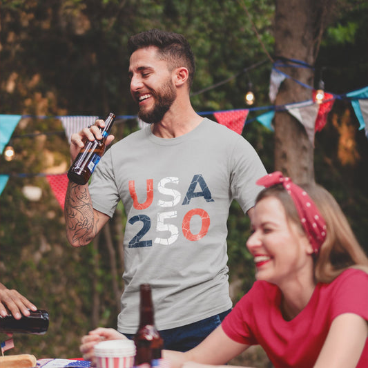 USA 250 Distressed Graphic Tee in Athletic Heather – couple at patriotic outdoor celebration wearing America 250 anniversary tee