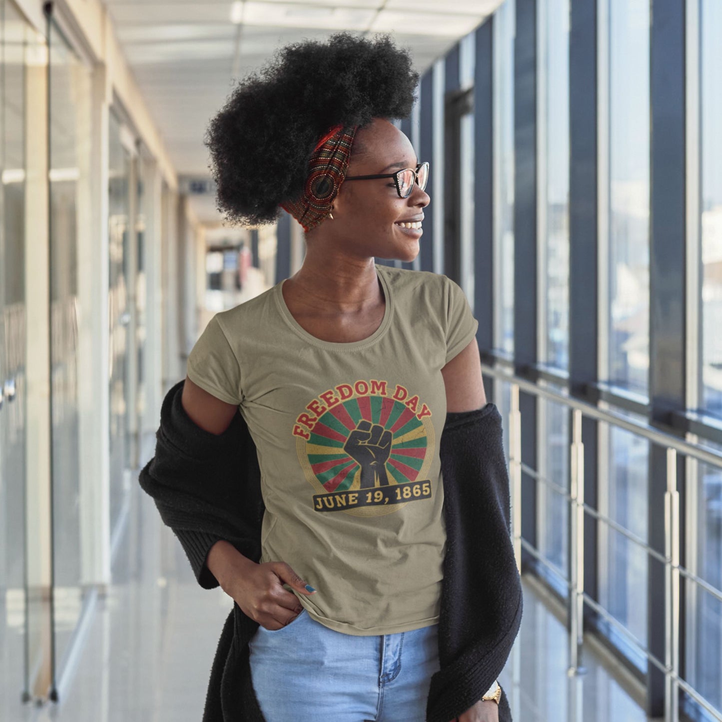 Freedom Day Juneteenth Tee in Heather Olive – woman wearing vintage raised fist sunburst graphic tee

