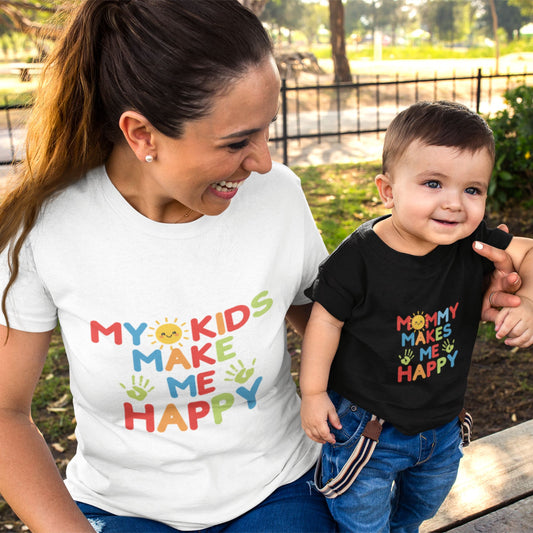 Mom and toddler wearing matching My Kids Make Me Happy and Mommy Makes Me Happy rainbow tees outdoors
