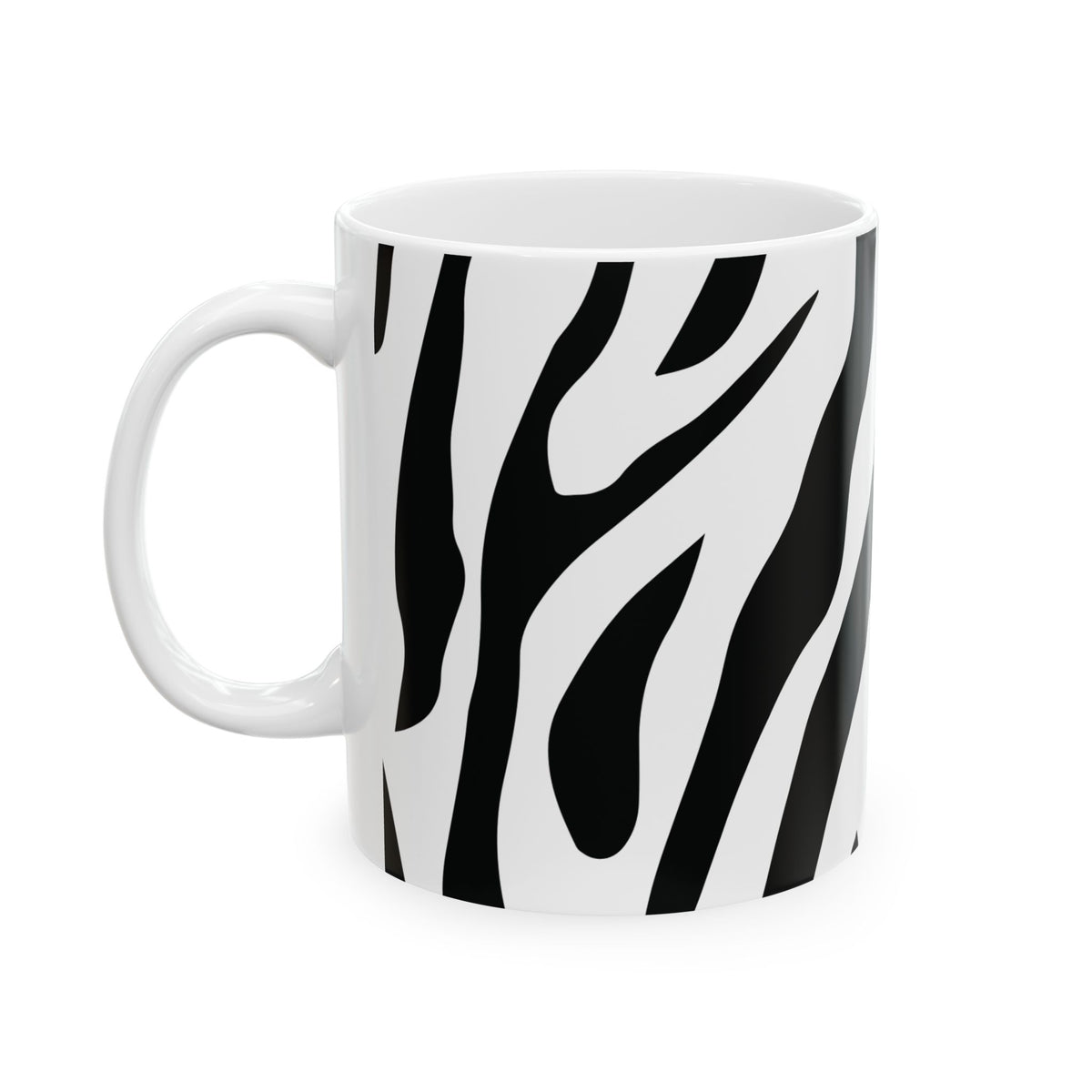 A white ceramic mug with a bold black zebra print pattern, shown against a plain white background.