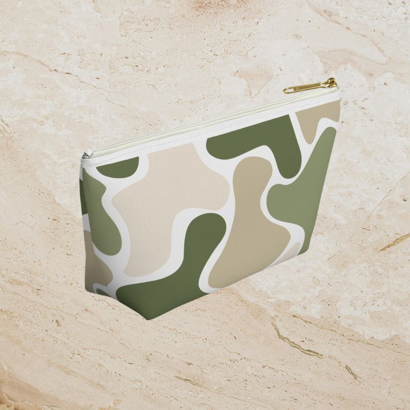 Another angled view of the sage and tan pouch on a warm stone surface.