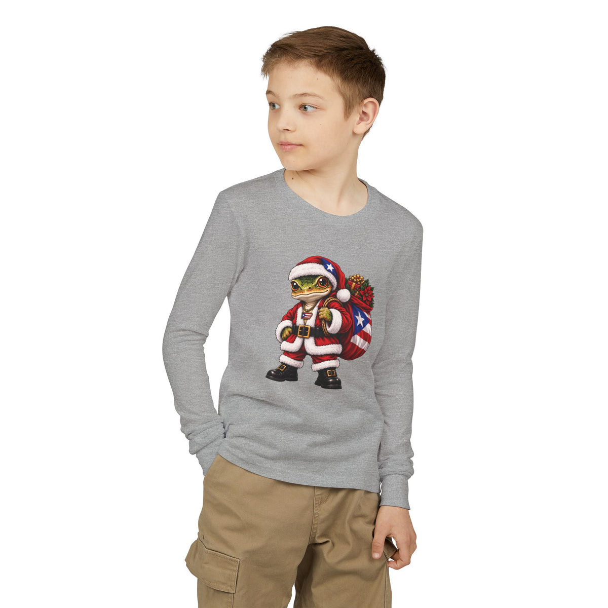 Child wearing a gray long-sleeve Christmas t-shirt featuring a Puerto Rican coquí graphic.