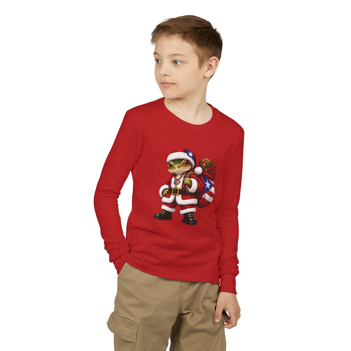 Child wearing a red long-sleeve Christmas t-shirt featuring a Puerto Rican coquí graphic.