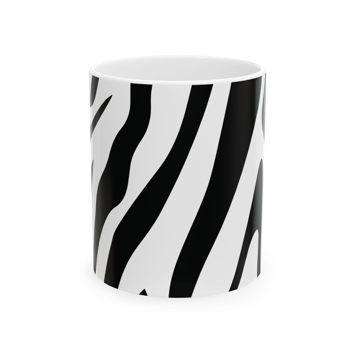 A white ceramic mug featuring a bold black zebra stripe pattern, shown against a plain white background.