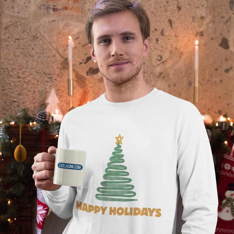 Model wearing the white “Happy Holidays” Christmas tree long-sleeve shirt.
