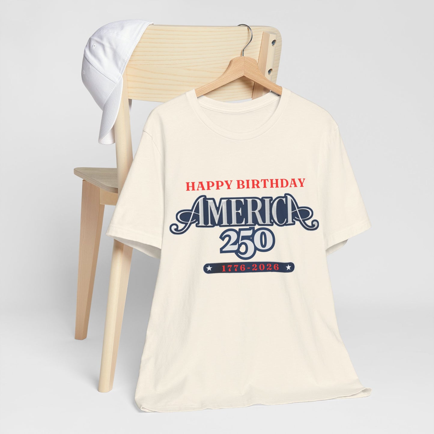 America 250 Happy Birthday T-Shirt in Natural – product mockup showing patriotic 1776-2026 celebration graphic on hanger

