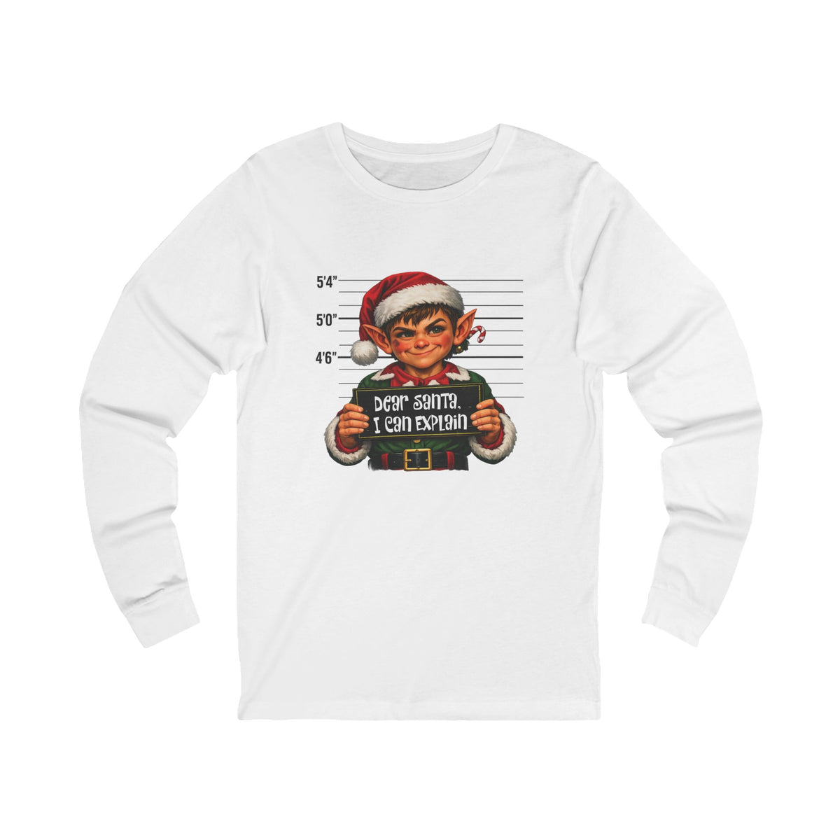 A white long-sleeve crewneck t-shirt featuring a graphic print of a mugshot-style portrait of an elf wearing a Santa hat, with the text 'DEER SANTA I CAN EXPLAIN' and height lines.