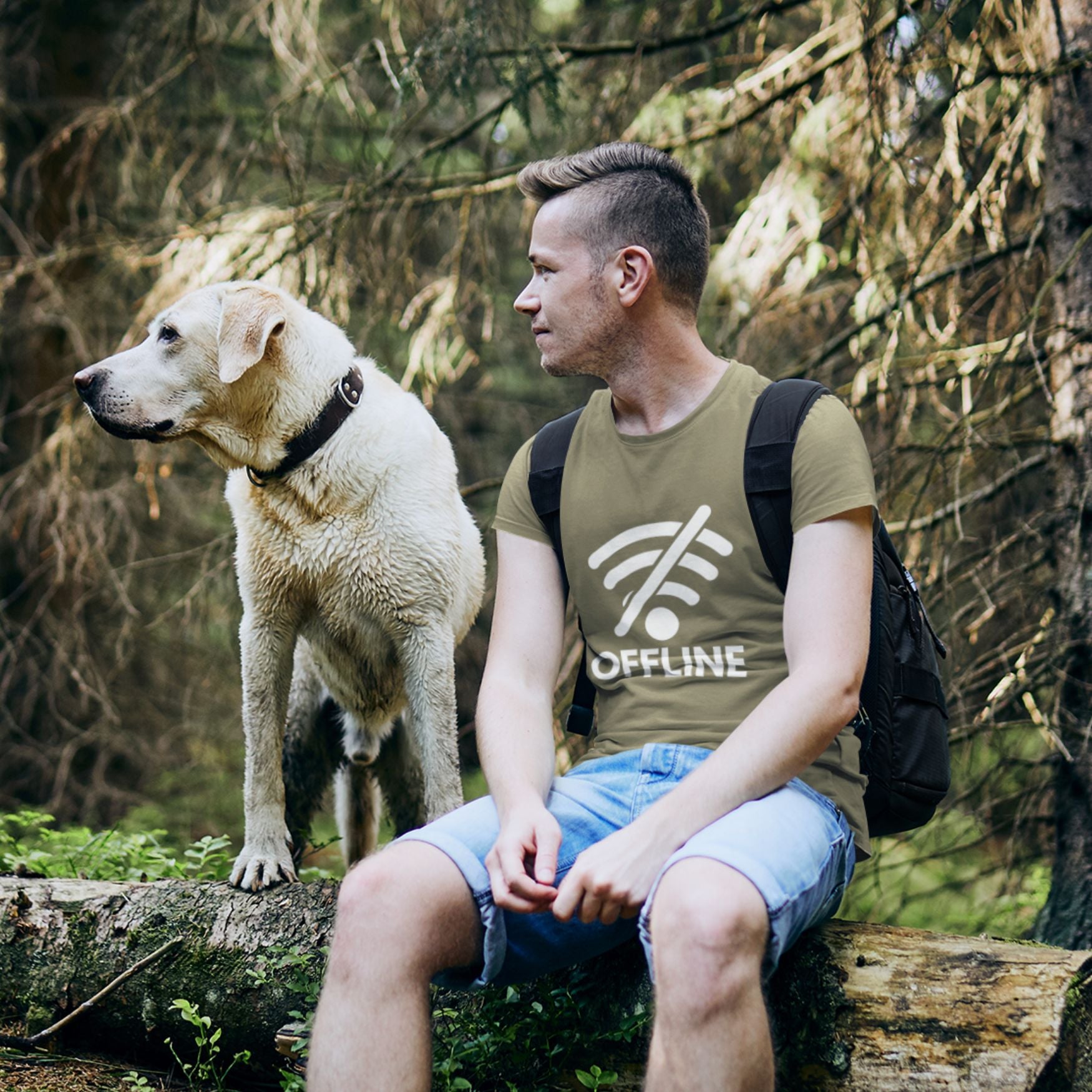 Man and golden retriever dog outdoors wearing OFFLINE crossed-out WiFi graphic tee — funny travel shirt
