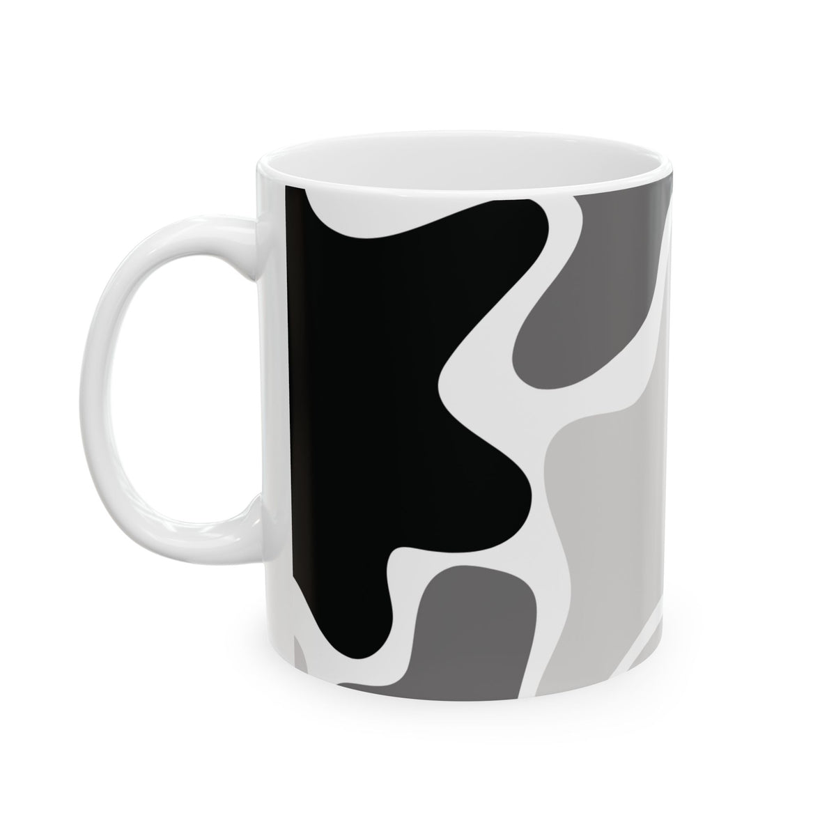White mug with handle on the left, showing a large black shape in the gray and white abstract pattern.