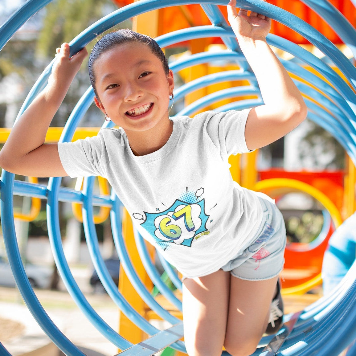 Child wearing Kids Six Seven Comic Pop Graphic T-Shirt in White, lifestyle shot