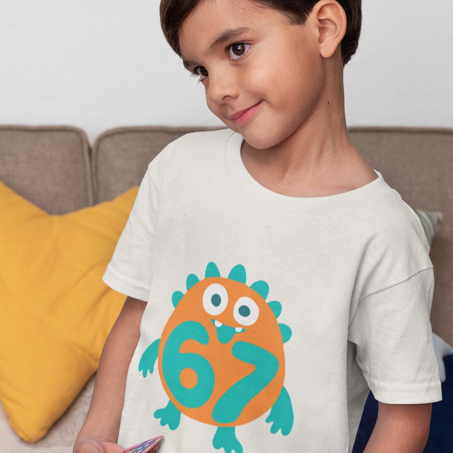 Boy wearing Kids 6/7 Monster T-Shirt in natural color, standing pose