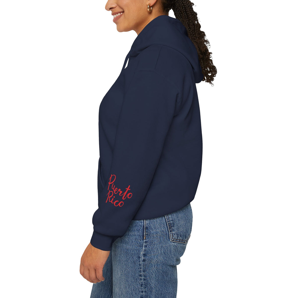 Side view of a person wearing a navy Puerto Rican coquí Santa hoodie with red “Puerto Rico” lettering on the sleeve.⠋