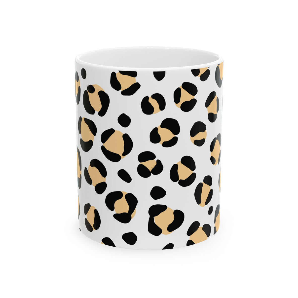 A white ceramic mug featuring a modern leopard print pattern with black spots and warm tan patches, shown against a plain white background.