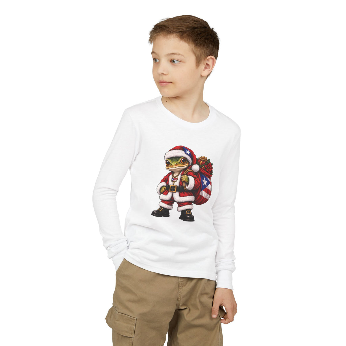 Child wearing a white long-sleeve Christmas t-shirt featuring a Puerto Rican coquí graphic.