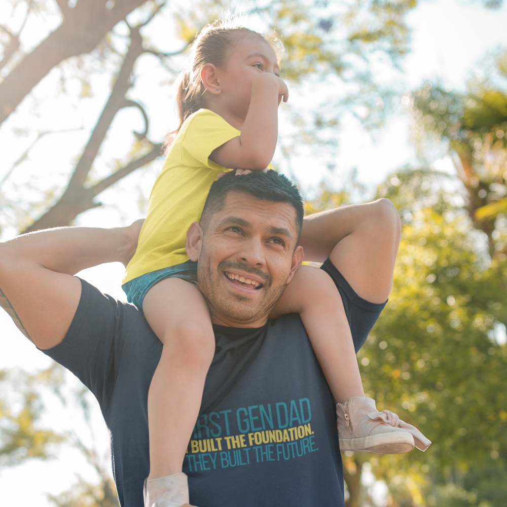 Father and child outdoor lifestyle shot wearing First Gen Dad graduation tee streetwear style