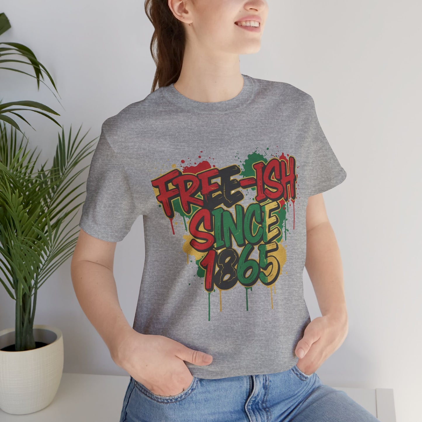 Free-ish Since 1865 Juneteenth Graphic Tee in Athletic Heather – woman wearing graffiti style emancipation tee indoors

