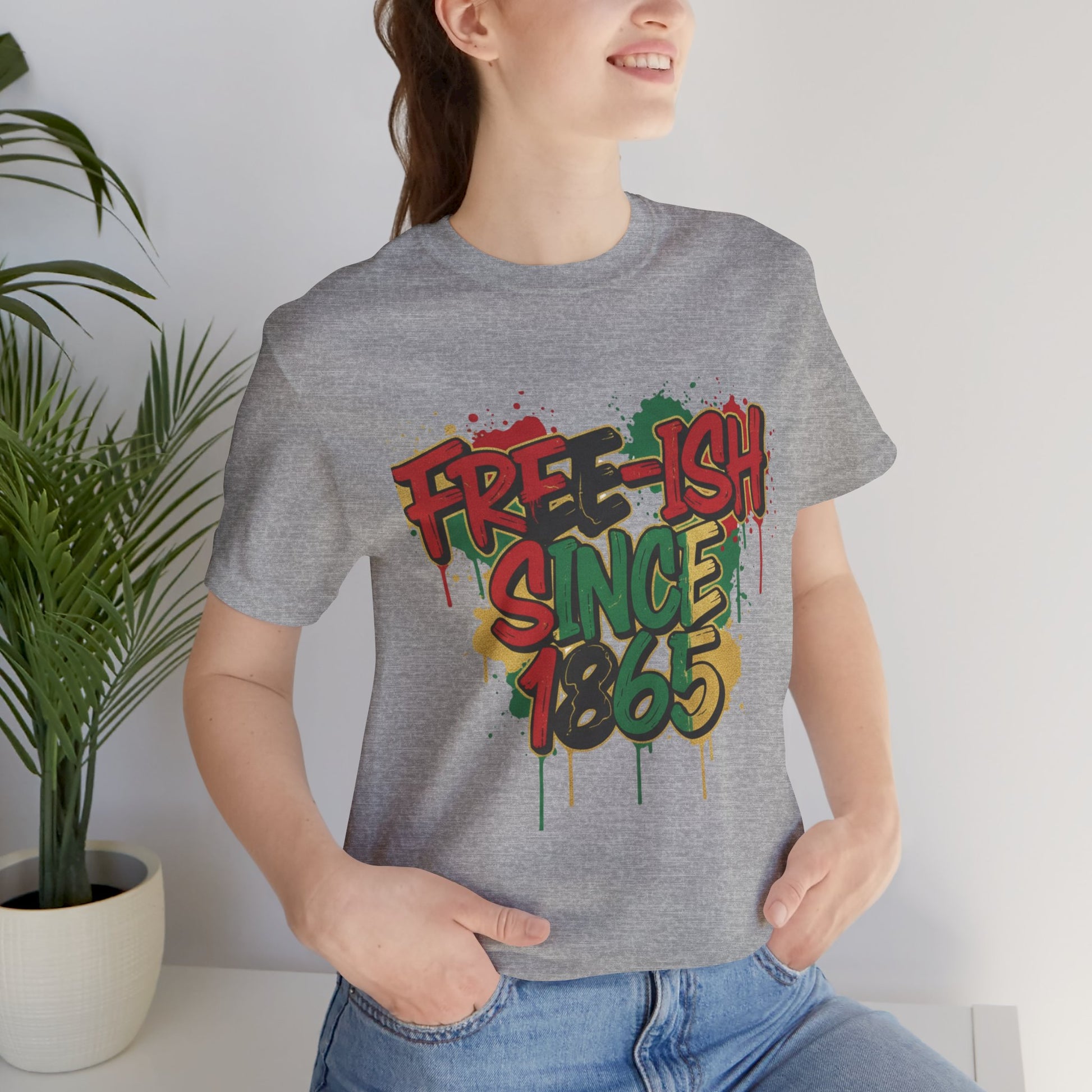 Free-ish Since 1865 Juneteenth Graphic Tee in Athletic Heather – woman wearing graffiti style emancipation tee indoors

