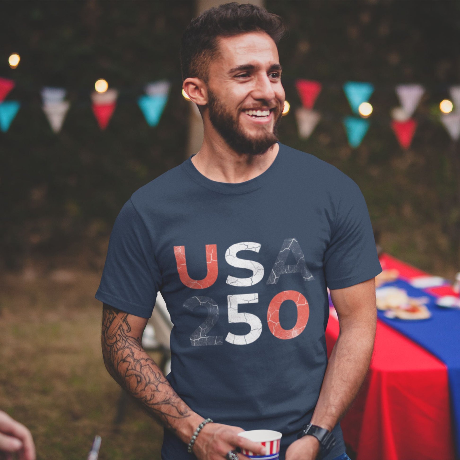 USA 250 Distressed Graphic Tee in Navy – man smiling at 4th of July patriotic party wearing America 250th anniversary shirt

