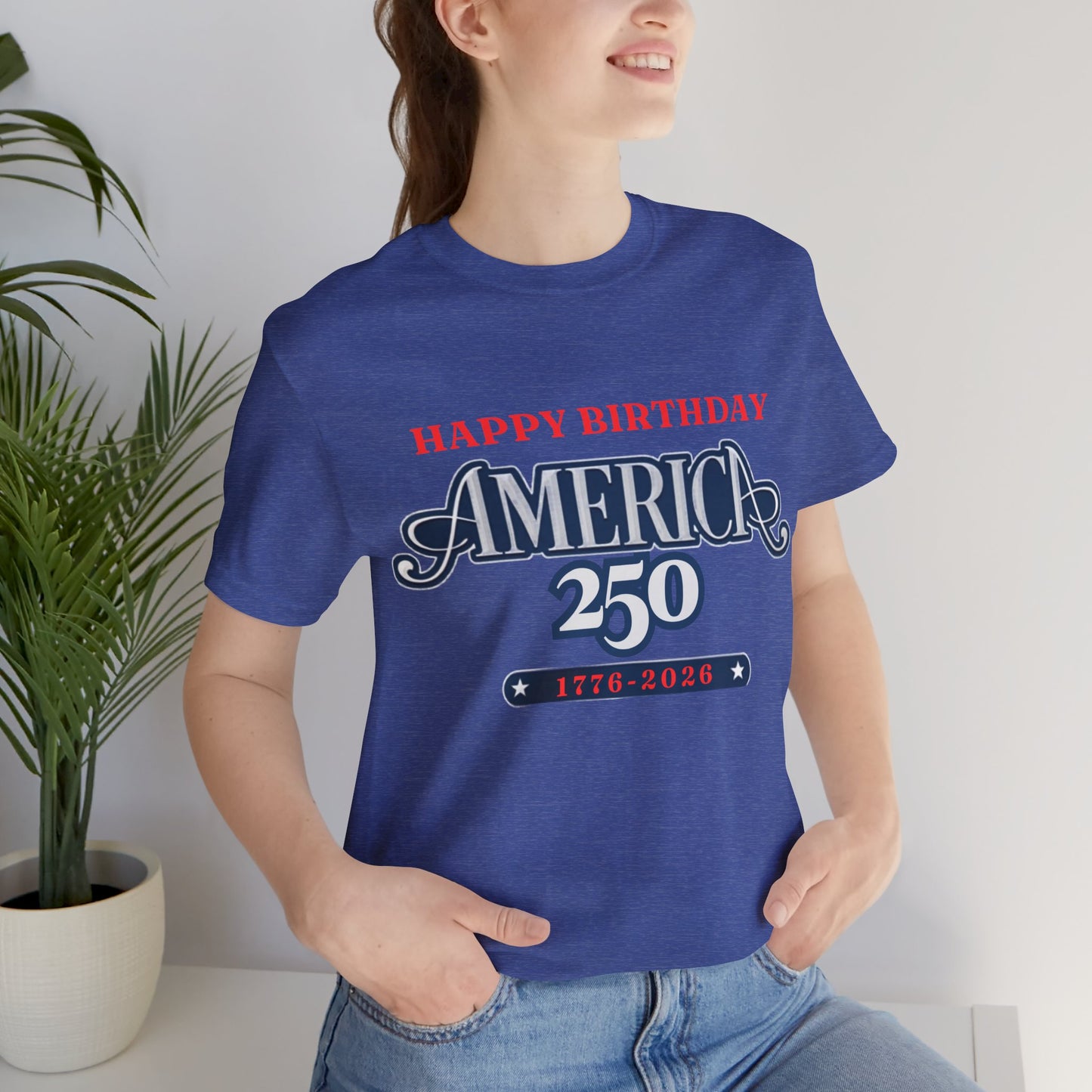 America 250 Happy Birthday T-Shirt in Heather True Royal – woman wearing patriotic USA 250th anniversary graphic tee indoors

