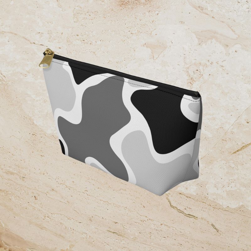 Angled view of the monochrome camouflage pouch showing its side and zipper.