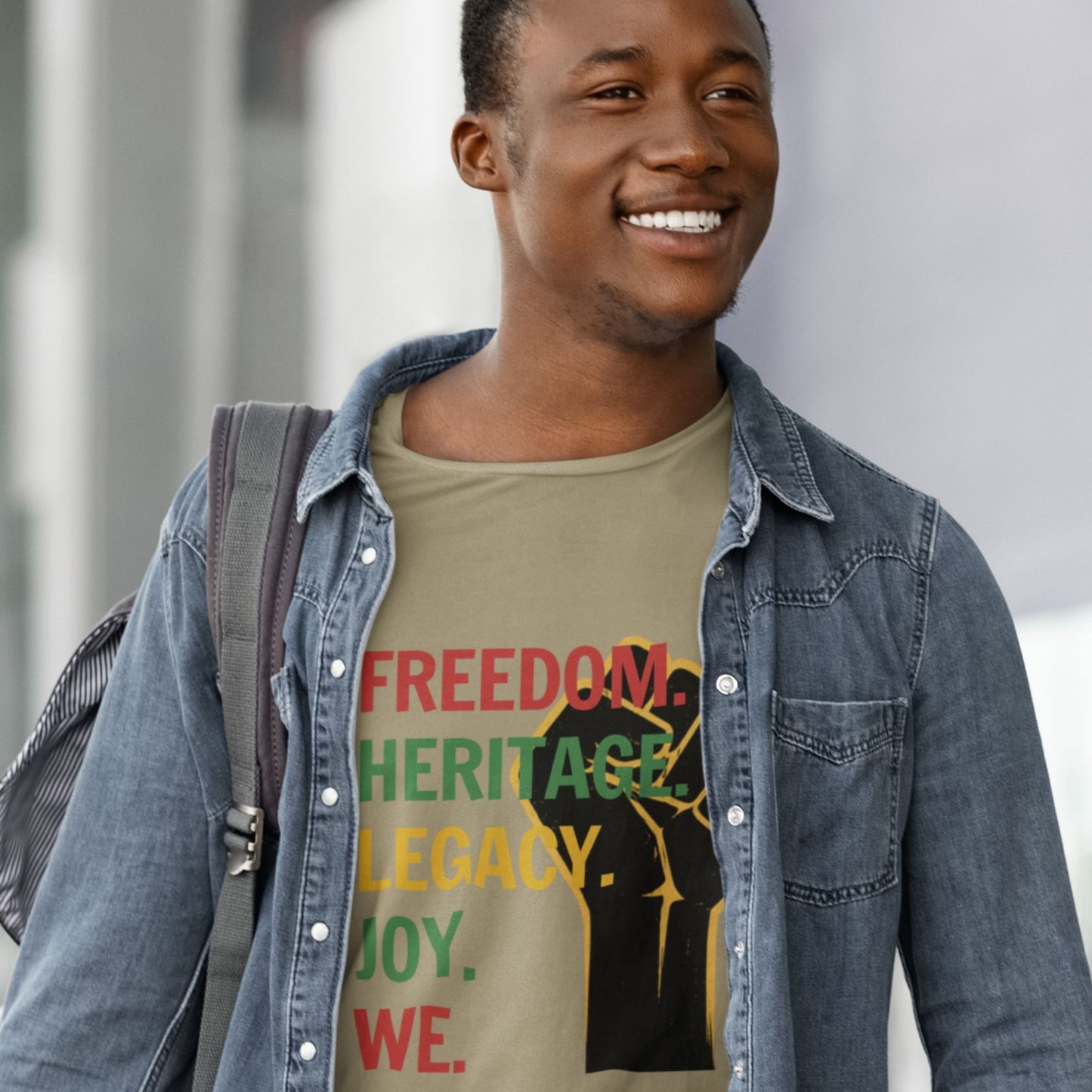 "Freedom Heritage Legacy Joy We Juneteenth Graphic Tee in Army Green – Black man smiling wearing raised fist design with denim jacket"


