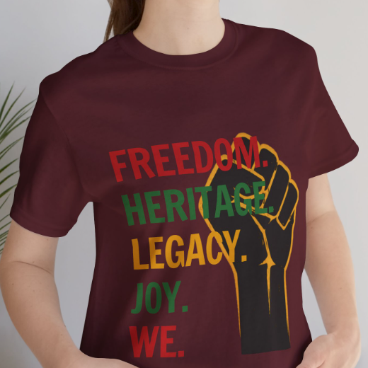 "Freedom Heritage Legacy Joy We Juneteenth Graphic Tee in Maroon – close-up of raised fist Emancipation design on model"

