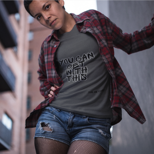 You Can Get With This graphic tee — bold graffiti streetwear on female model styled with flannel and denim shorts in urban setting