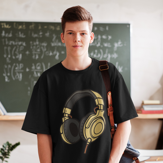 Teen boy wearing Adult Unisex Headphones Graphic T-Shirt in White, classroom lifestyle shot