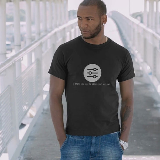 video of the I Think You Need to Adjust Your Settings tech graphic t-shirt showing fit and print details.