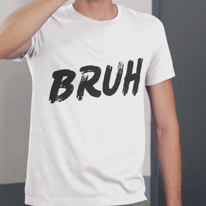 Man modeling a white graphic t-shirt with bold black “BRUH” lettering on the front and “REALLY” lettering on the back.