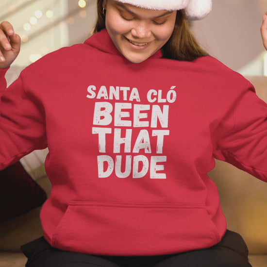Video of a woman wearing a red Santa Cló Been That Dude hoodie and Santa hat