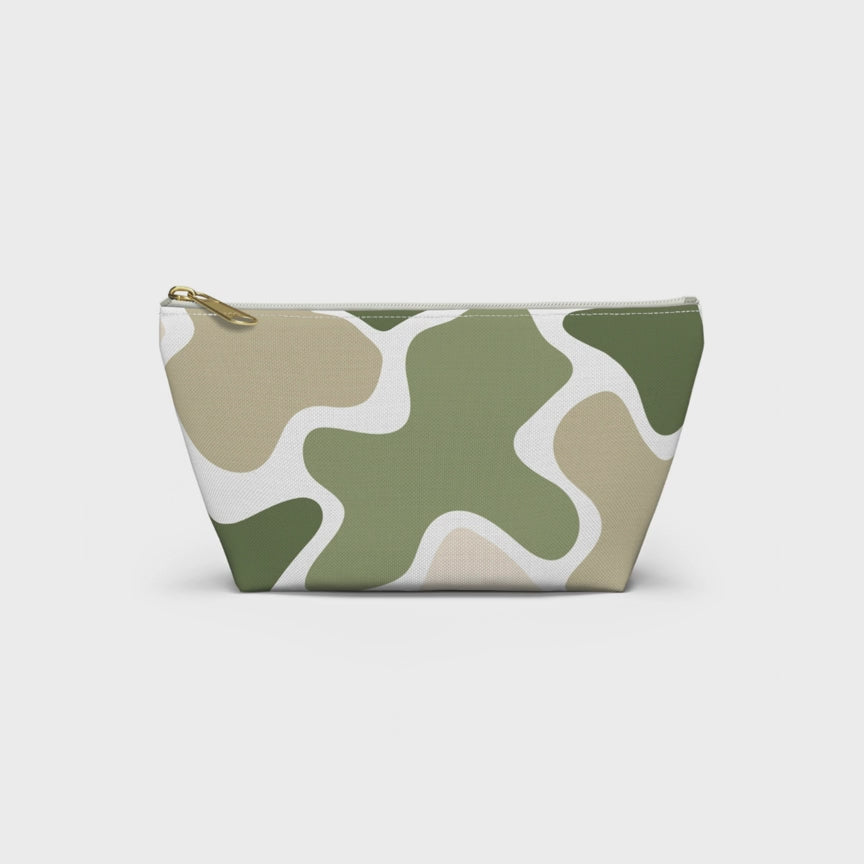 Product slideshow of a sage green and beige abstract camo accessory pouch with a white zipper and gold-tone pull, displayed against a white background.
