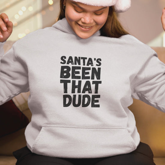 Video preview of a person wearing a white “Santa’s Been That Dude” hoodie.
