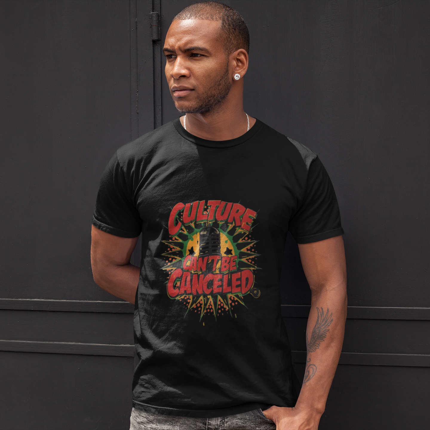 Culture Can't Be Canceled graphic tee — bold activist streetwear on male model in urban setting