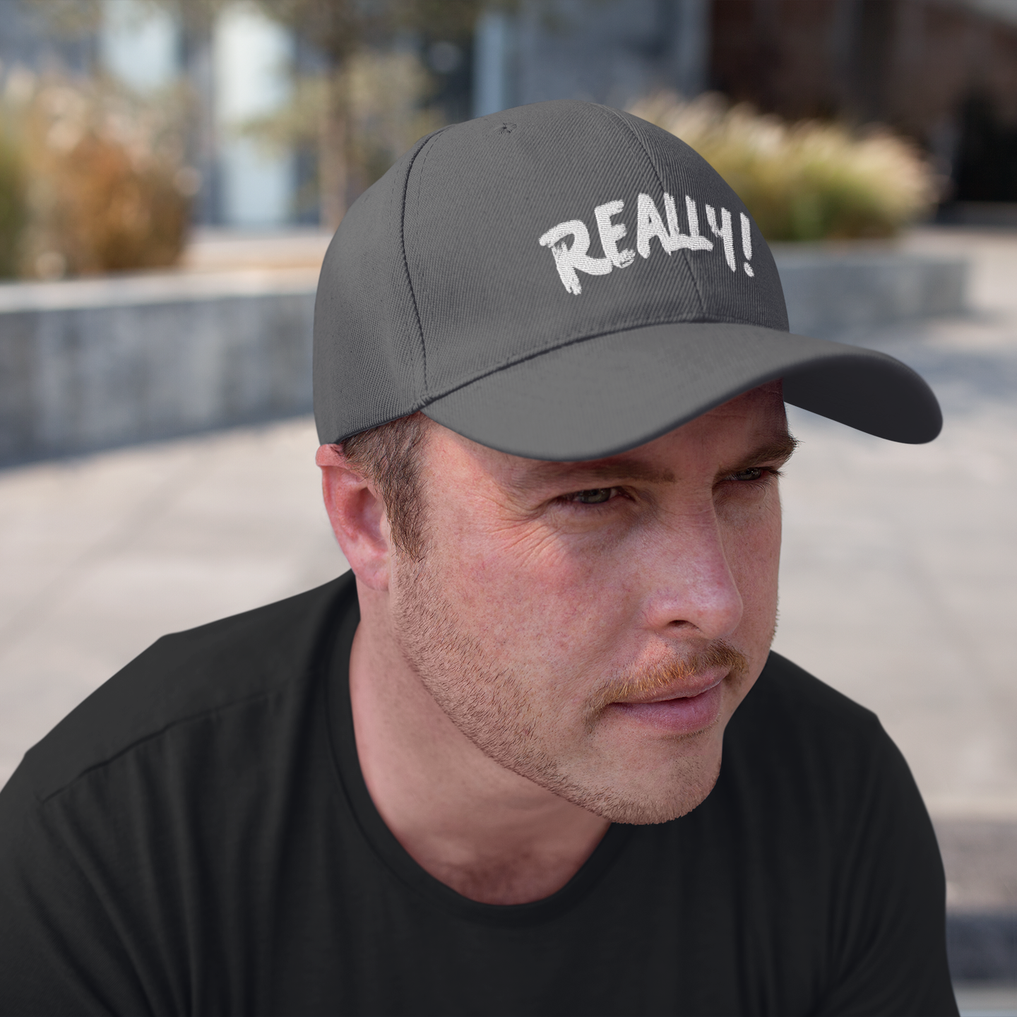 "Really! black dad cap — side profile view worn by male model in black shirt